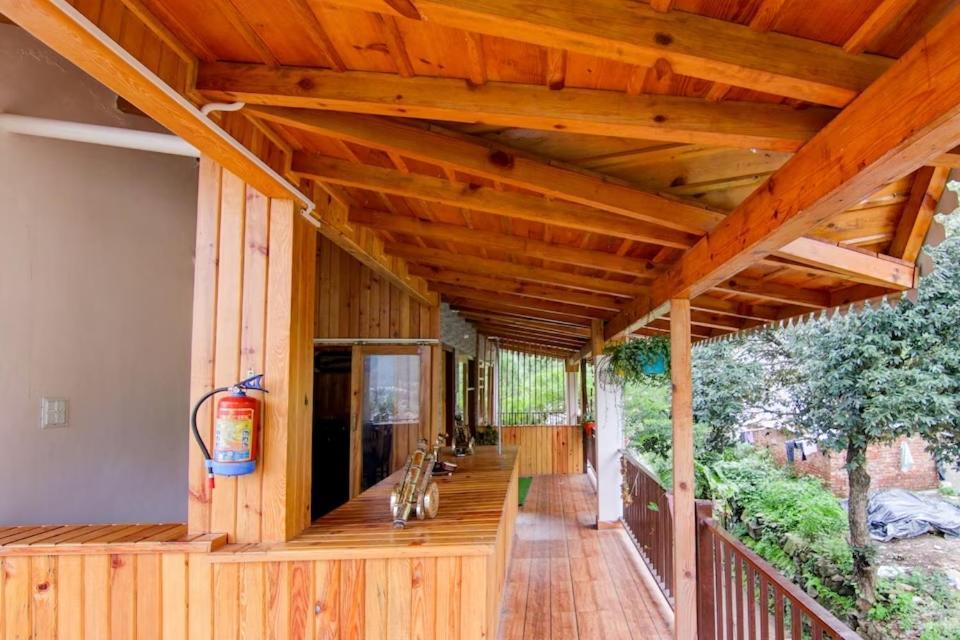 The Wooden Umbrella Near Kaichi Dhaam Homestay Bhimtal