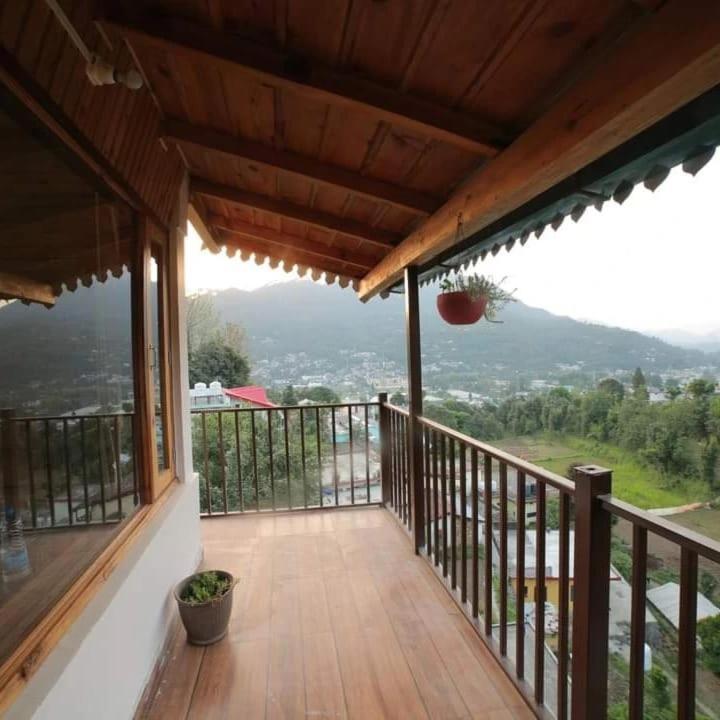The Wooden Umbrella Near Kaichi Dhaam